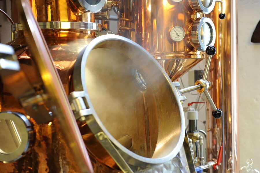 Dordrecht: Distillery Tour with Dutch Gin & Genever Tasting - Inside the still room and barrel area
