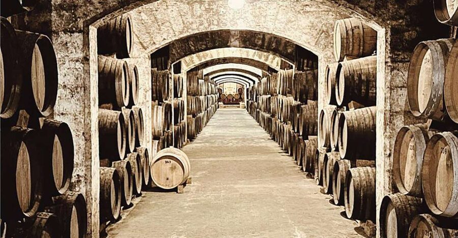 Palma: Distillery Tour with 6 Spirits and Tapas Tasting - Entering Bodegas Suau near Palma