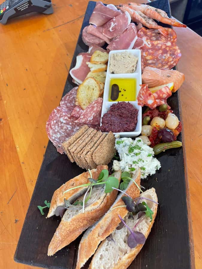 Waiheke: Scenic Taste and Graze Tour with Wine, Whisky, Beer - Mudbrick: a scenic opening with wine